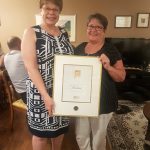 Heather Andrews receiving the Royal LePage President's Gold Award for sales in 2017