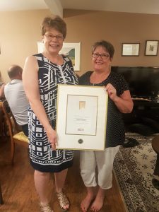 Heather Andrews receiving the Royal LePage President's Gold Award for sales in 2017